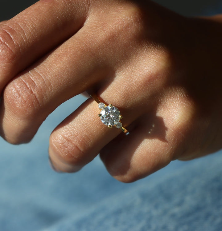 Celestia Three Stone Round Cut Moissanite Ring
