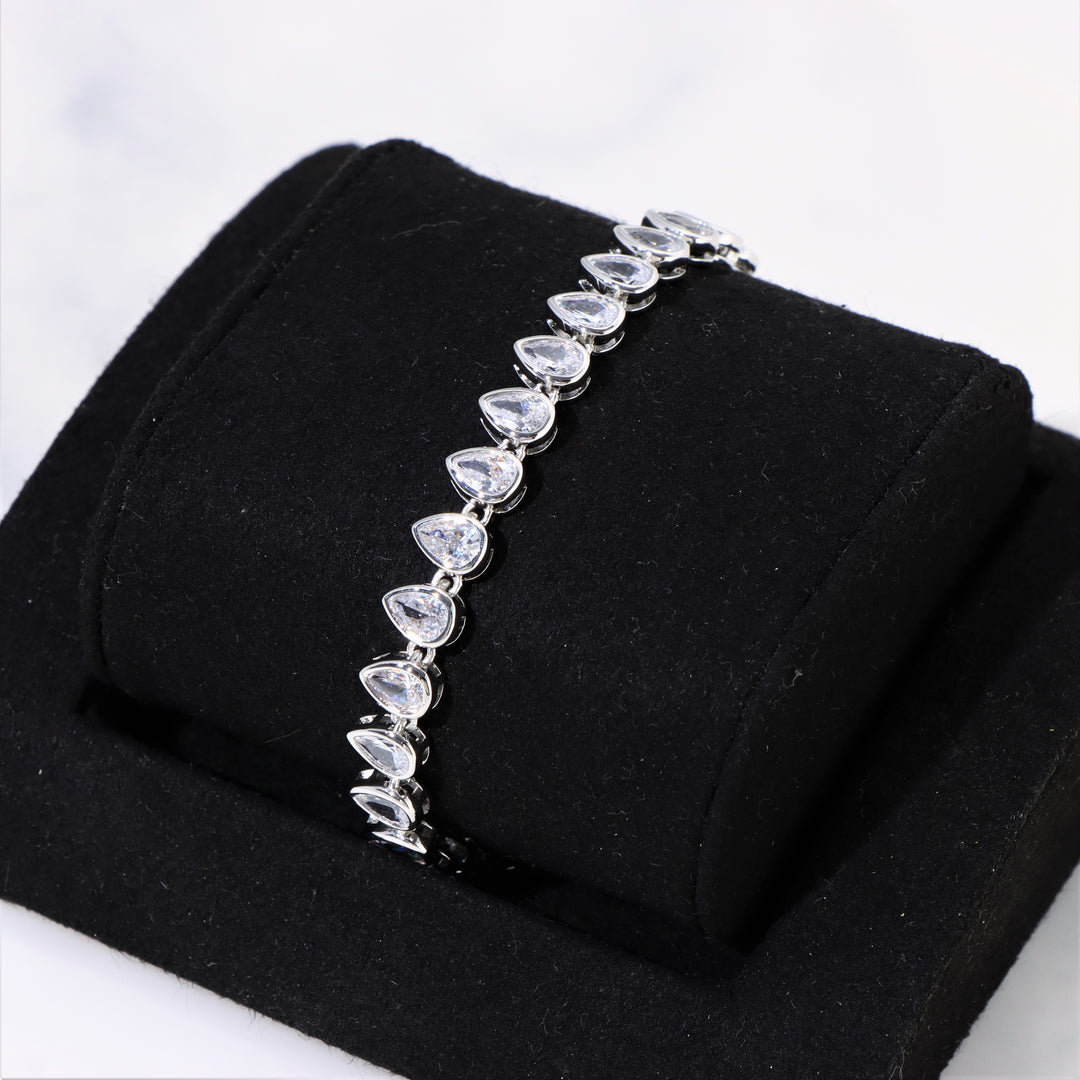 Women's Pear Cut Bezel Tennis Bracelet in White Gold