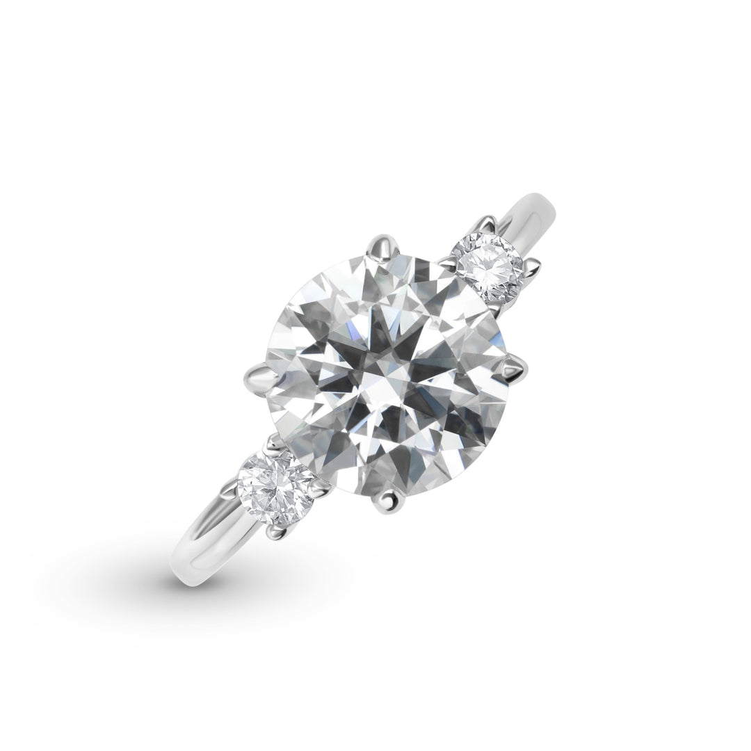 Celestia Three Stone Round Cut Moissanite Ring