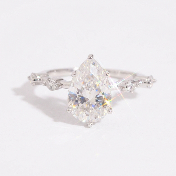 Eterna Pear Cut Moissanite Ring with Accent Stones