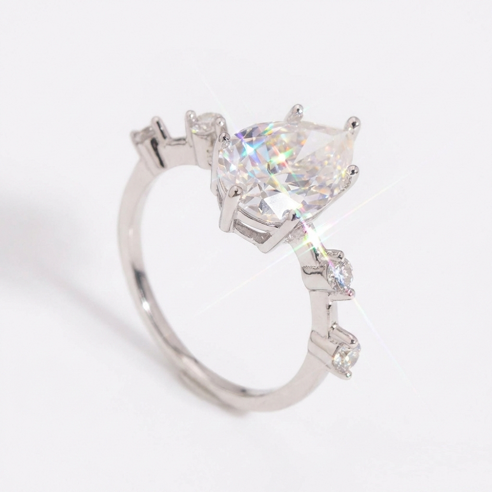 Eterna Pear Cut Moissanite Ring with Accent Stones