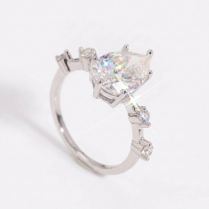 Eterna Pear Cut Moissanite Ring with Accent Stones