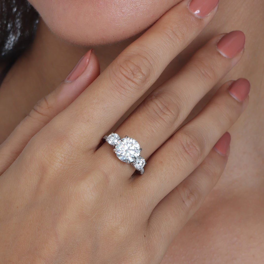 Adorned Celestia Three Stone Round Cut Moissanite Ring