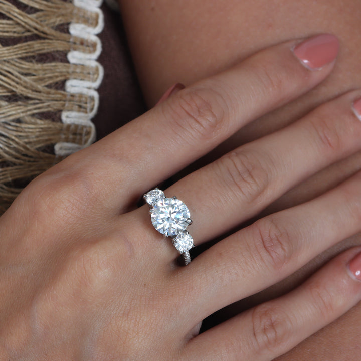 Adorned Celestia Three Stone Round Cut Moissanite Ring